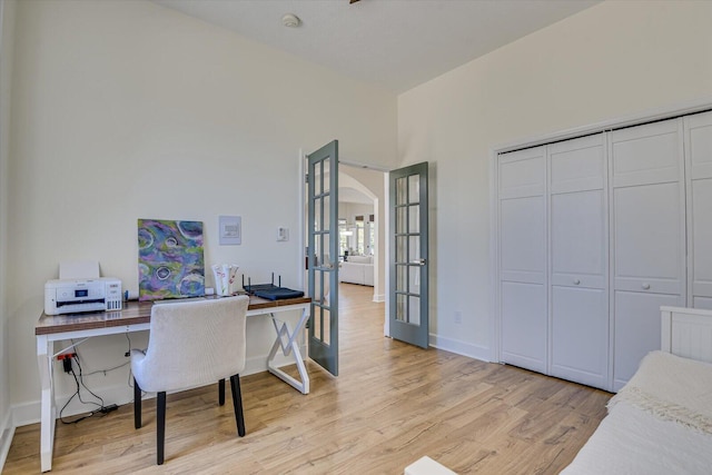341 Crown Pt, Mccormick, SC 29835 - home office with arched walkways, baseboards, french doors, and light wood finished floors