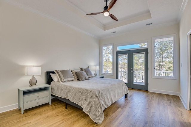341 Crown Pt, Mccormick, SC 29835 - bedroom with access to outside, light wood-style floors, visible vents, and a raised ceiling