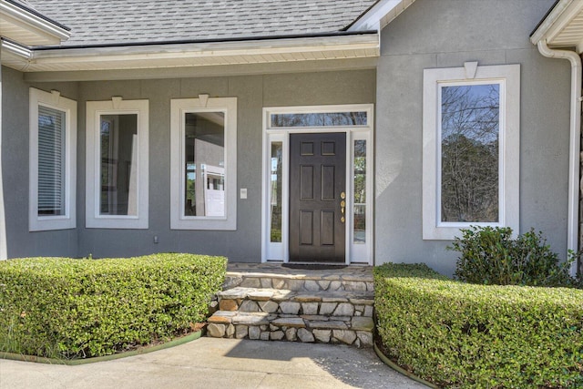 341 Crown Pt, Mccormick, SC 29835 - doorway to property featuring stucco siding and roof with shingles