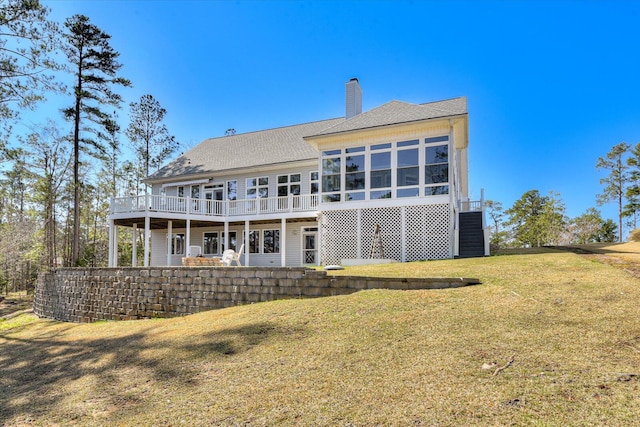 341 Crown Pt, Mccormick, SC 29835 - rear view of property with roof with shingles, a chimney, a wooden deck, a lawn, and a sunroom