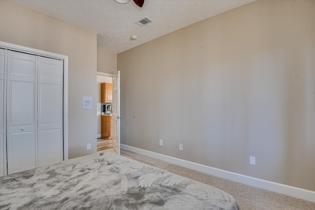 341 Crown Pt, Mccormick, SC 29835 - bedroom featuring light carpet, baseboards, visible vents, and a closet