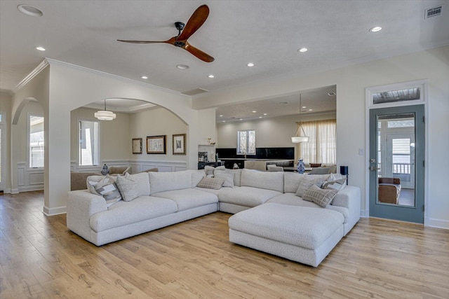 341 Crown Pt, Mccormick, SC 29835 - living room with light wood-style flooring, arched walkways, plenty of natural light, visible vents, and ornamental molding