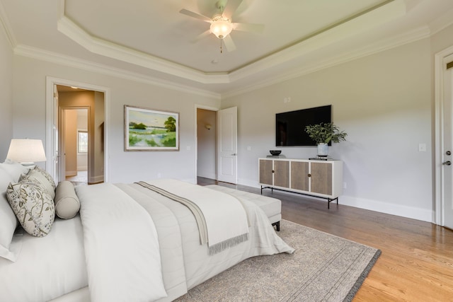 151 Commonwealth Way, Aiken, SC 29803 - bedroom with a raised ceiling, wood finished floors, crown molding, and a ceiling fan