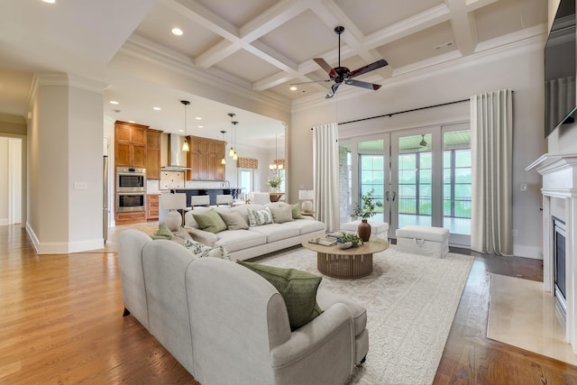 151 Commonwealth Way, Aiken, SC 29803 - living room with a high ceiling, a ceiling fan, beamed ceiling, a fireplace with flush hearth, and crown molding