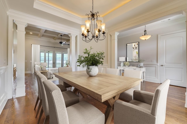 151 Commonwealth Way, Aiken, SC 29803 - dining room with decorative columns, coffered ceiling, crown molding, a ceiling fan, and a decorative wall