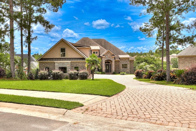 151 Commonwealth Way, Aiken, SC 29803 - view of front of house featuring stone siding, curved driveway, stucco siding, and a front yard