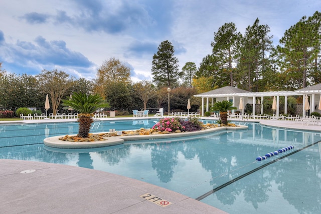 151 Commonwealth Way, Aiken, SC 29803 - community pool featuring a pergola, view of scattered trees, and a patio