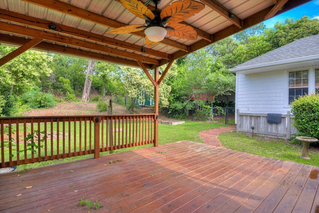 wooden deck with a ceiling fan