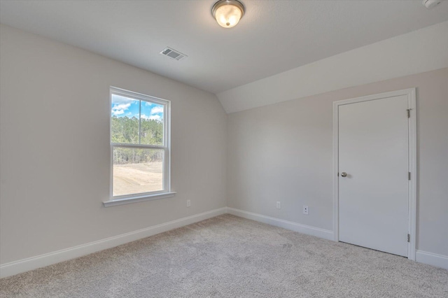 1282 Elias Sta, Thomson, GA 30824 - spare room featuring carpet floors, baseboards, and lofted ceiling