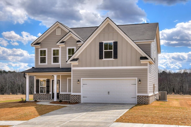 1282 Elias Sta, Thomson, GA 30824 - view of front of house with a porch, cooling unit, board and batten siding, driveway, and an attached garage