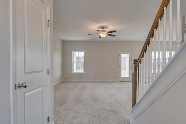 1282 Elias Sta, Thomson, GA 30824 - unfurnished room with baseboards, ceiling fan, light colored carpet, and stairway