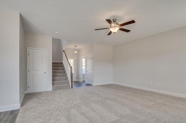 1282 Elias Sta, Thomson, GA 30824 - carpeted empty room featuring stairway, a ceiling fan, and baseboards