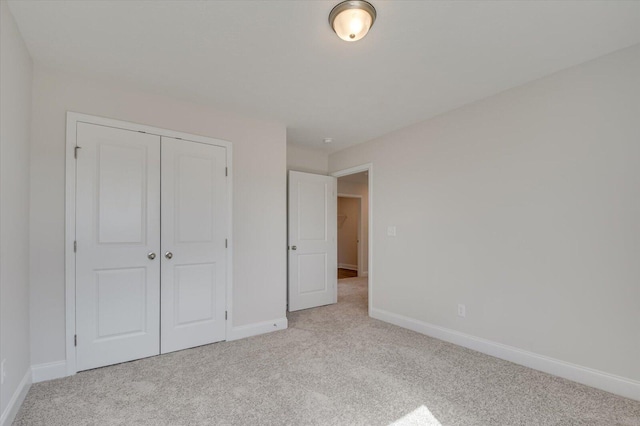 1282 Elias Sta, Thomson, GA 30824 - unfurnished bedroom with light colored carpet, baseboards, and a closet