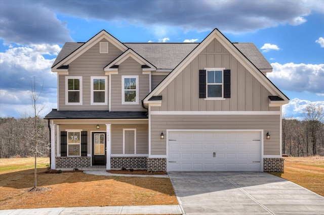 1282 Elias Sta, Thomson, GA 30824 - view of front facade with a porch, brick siding, board and batten siding, concrete driveway, and an attached garage