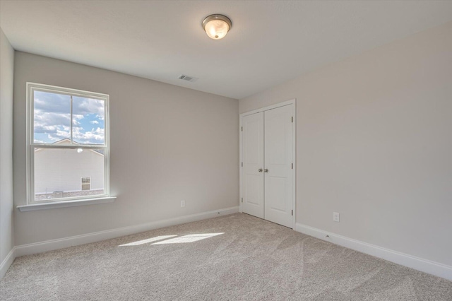1282 Elias Sta, Thomson, GA 30824 - unfurnished bedroom with baseboards, carpet flooring, and a closet