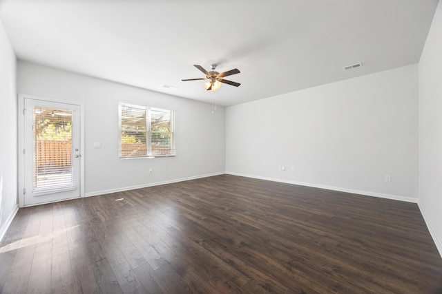 unfurnished room with ceiling fan and dark hardwood / wood-style flooring