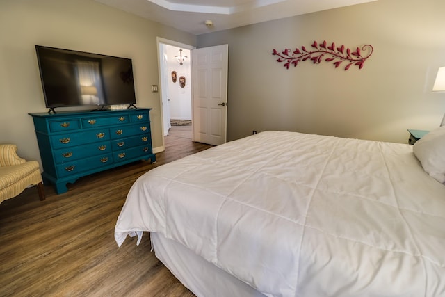 bedroom featuring dark wood-type flooring