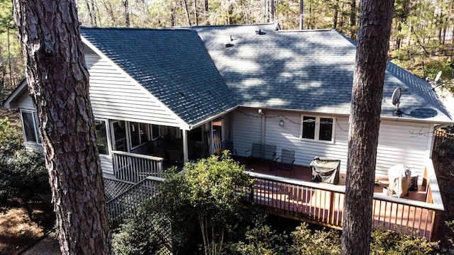 back of property featuring a deck