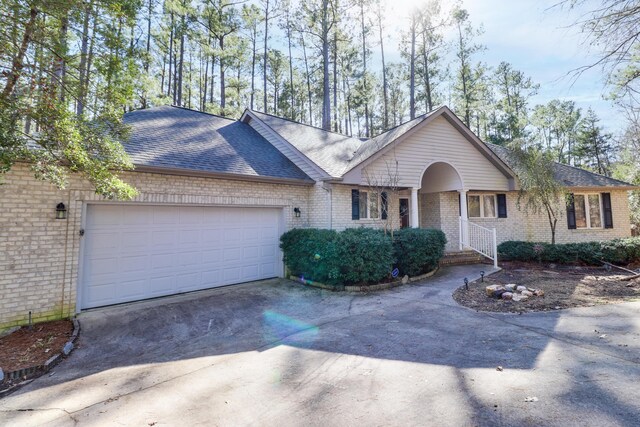 ranch-style house featuring a garage