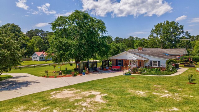 226 Elam Hts, Lincolnton, GA 30817 - view of front facade with a chimney and brick siding
