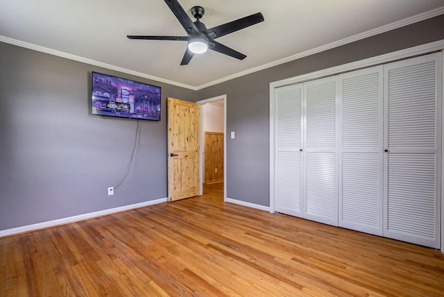 226 Elam Hts, Lincolnton, GA 30817 - unfurnished bedroom with baseboards, light wood-type flooring, a closet, crown molding, and a ceiling fan