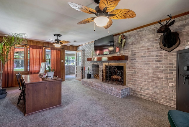 226 Elam Hts, Lincolnton, GA 30817 - carpeted office with ceiling fan, a fireplace, brick wall, ornamental molding, and wood walls