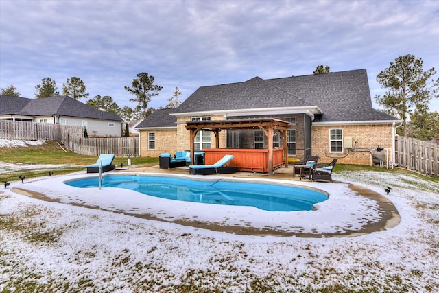 view of pool featuring a hot tub, a pergola, and a patio