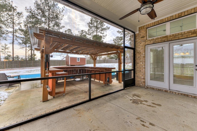 view of patio featuring a fenced in pool, a pergola, and ceiling fan