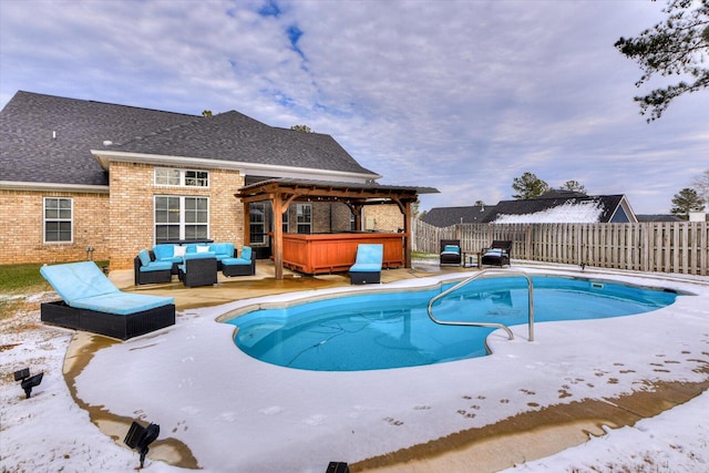 view of swimming pool with a hot tub and an outdoor hangout area