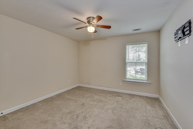 carpeted empty room with ceiling fan