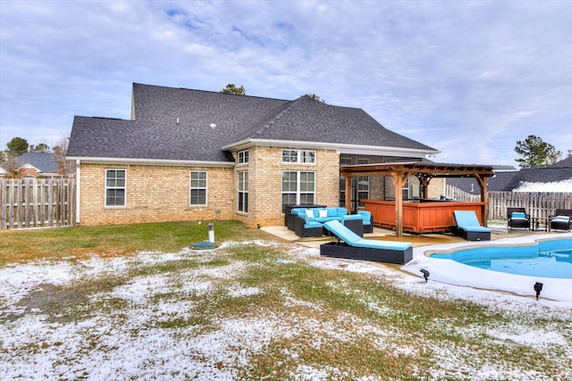 rear view of property with a patio, outdoor lounge area, a pool with hot tub, and a pergola