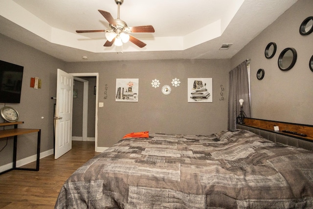 3107 Camden Way, Graniteville, SC 29829 - bedroom featuring a raised ceiling, wood finished floors, and ceiling fan