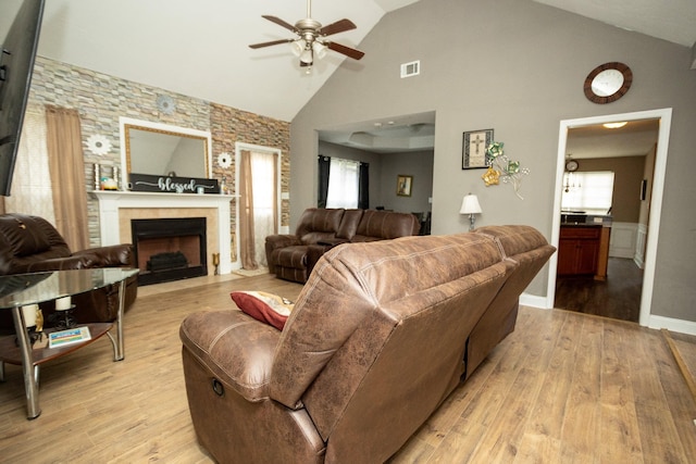 3107 Camden Way, Graniteville, SC 29829 - living area with ceiling fan, a tile fireplace, light wood-style flooring, and high vaulted ceiling