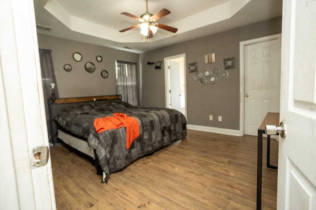 3107 Camden Way, Graniteville, SC 29829 - bedroom with a tray ceiling, light wood-style floors, and ceiling fan