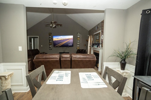 3107 Camden Way, Graniteville, SC 29829 - dining room with wood finished floors, ceiling fan, wainscoting, a decorative wall, and a fireplace