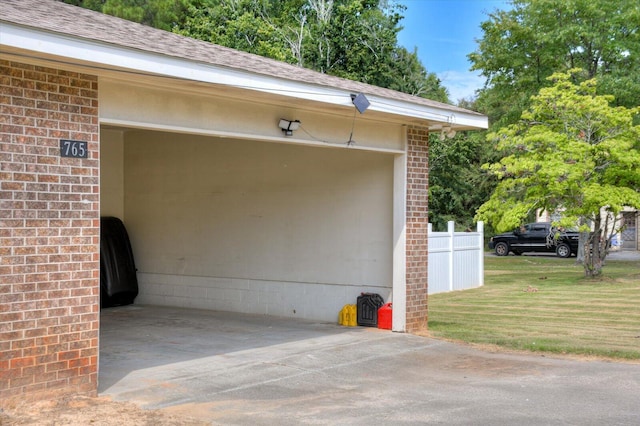 garage featuring a lawn