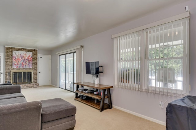 living room with carpet floors and a brick fireplace