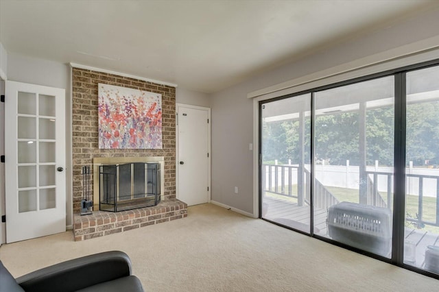 unfurnished living room featuring a fireplace and carpet flooring