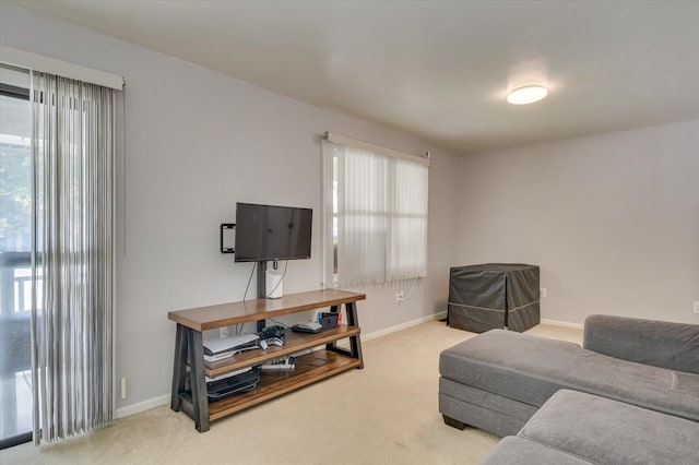 carpeted living room featuring a healthy amount of sunlight