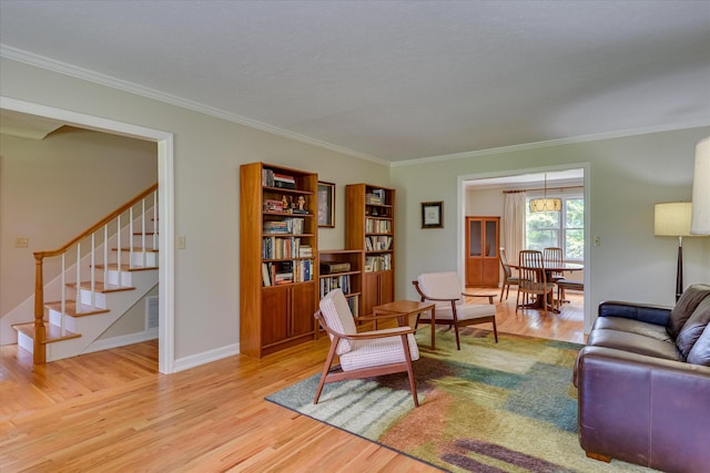 802 Dunbarton Dr, North Augusta, SC 29841 - living area featuring crown molding, light wood-style floors, and stairs