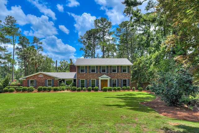 802 Dunbarton Dr, North Augusta, SC 29841 - colonial house with brick siding, a front lawn, and a chimney