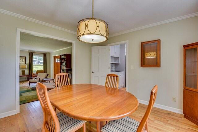 802 Dunbarton Dr, North Augusta, SC 29841 - dining space featuring light wood finished floors and crown molding