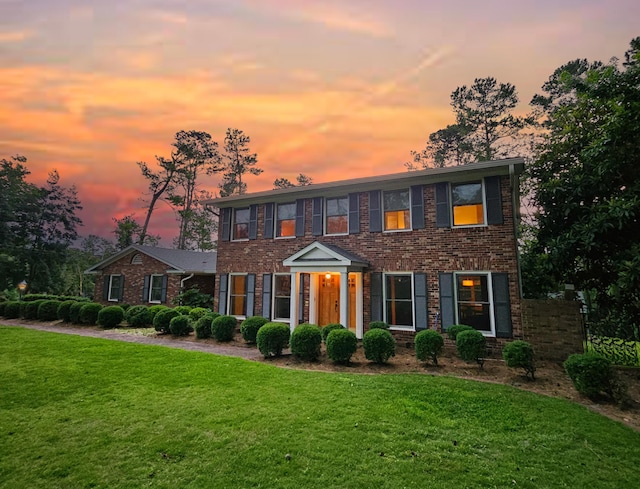 802 Dunbarton Dr, North Augusta, SC 29841 - colonial-style house with brick siding and a front lawn