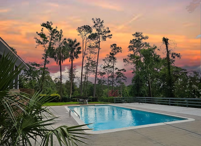 802 Dunbarton Dr, North Augusta, SC 29841 - pool at dusk featuring a patio area