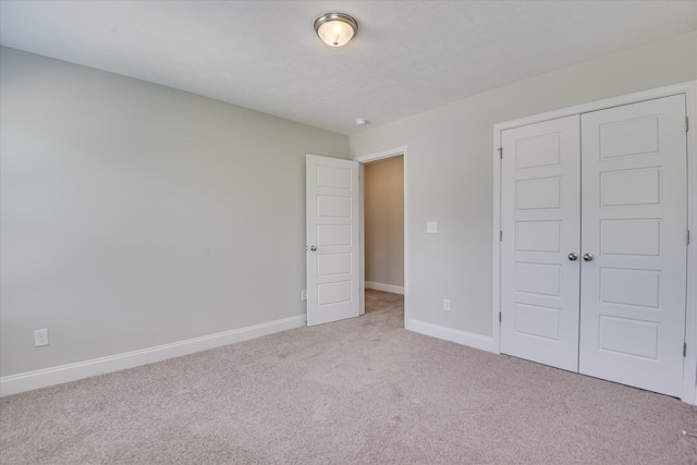 5816 Whispering Pines Way, Evans, GA 30809 - unfurnished bedroom featuring carpet floors, a closet, and baseboards