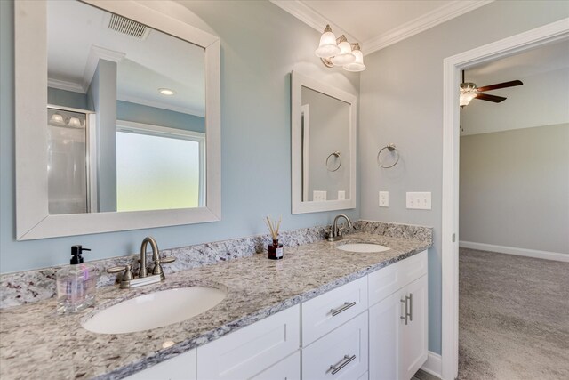 5816 Whispering Pines Way, Evans, GA 30809 - full bathroom with crown molding, double vanity, baseboards, ceiling fan, and an enclosed shower