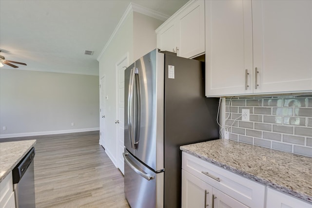 5816 Whispering Pines Way, Evans, GA 30809 - kitchen with ornamental molding, stainless steel appliances, tasteful backsplash, white cabinetry, and light wood finished floors