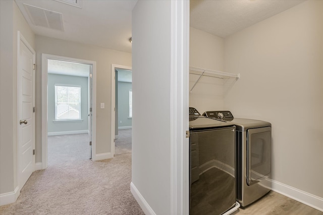 5816 Whispering Pines Way, Evans, GA 30809 - laundry room featuring washing machine and clothes dryer, baseboards, and light carpet