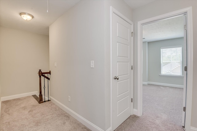 5816 Whispering Pines Way, Evans, GA 30809 - hall featuring an upstairs landing, carpet flooring, and baseboards