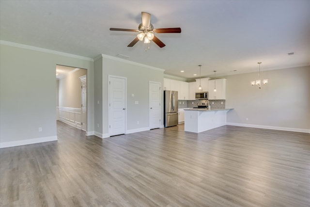 5816 Whispering Pines Way, Evans, GA 30809 - unfurnished living room with a chandelier, light wood-style floors, crown molding, ceiling fan, and recessed lighting